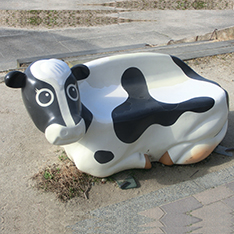 Fiberglass cow bench statue